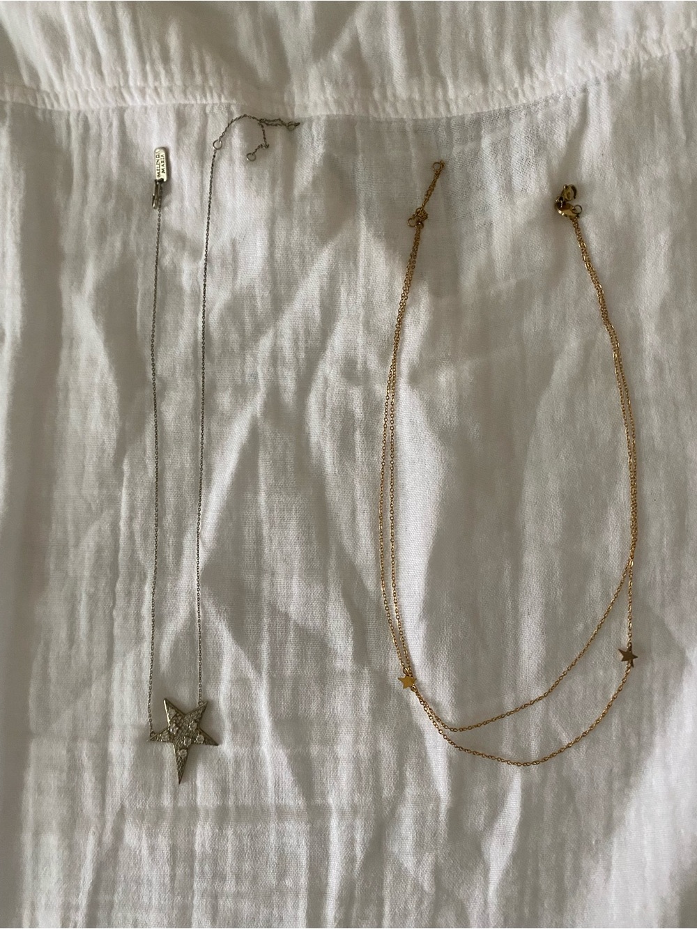 Two star themed necklaces.